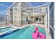Spacious backyard pool and jacuzzi with outdoor seating, ideal for entertaining at 9175 Sommerset Hills Dr, Davenport, FL 33896