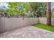Private backyard includes brick pavers and grass at 108 Crown Oaks Way, Longwood, FL 32779