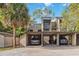 Multi-unit carport showing parking and storage areas under the condos at 108 Crown Oaks Way, Longwood, FL 32779