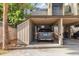 Carport area with a parked SUV and storage area attached to the building at 108 Crown Oaks Way, Longwood, FL 32779