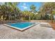 Enjoy the community pool with inviting layout, ample decking, and surrounding greenery at 108 Crown Oaks Way, Longwood, FL 32779