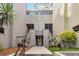 Complex exterior showcasing unit entrances and stairs, set among lush trees at 108 Crown Oaks Way, Longwood, FL 32779