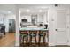 Open kitchen concept with breakfast bar seating and stainless steel appliances at 108 Crown Oaks Way, Longwood, FL 32779