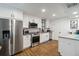 Bright kitchen features stainless steel appliances and granite countertops at 108 Crown Oaks Way, Longwood, FL 32779