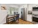 Kitchen with stainless steel appliances next to desk with computer at 108 Crown Oaks Way, Longwood, FL 32779