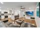 Living room showcasing an open concept, modern furniture, wood floors and an adjacent kitchen at 108 Crown Oaks Way, Longwood, FL 32779