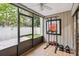 Sunroom with exercise equipment and view of green yard at 108 Crown Oaks Way, Longwood, FL 32779