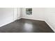 A modern bedroom features sleek gray tile flooring, complemented by crisp white walls and trim at 1122 Romar Ln, Apopka, FL 32712