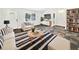 Cozy living room featuring modern furnishings, stylish decor, and beautiful flooring at 1122 Romar Ln, Apopka, FL 32712
