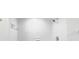 A shower features bright white tiles at 1122 Romar Ln, Apopka, FL 32712