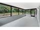 The sunroom offers a light-filled, versatile space surrounded by views of the lush landscape at 1122 Romar Ln, Apopka, FL 32712