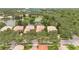 Aerial view of luxurious homes nestled among lush trees and serene lakes, showcasing community at 11834 Gennaro Ln, Orlando, FL 32827