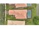 Aerial view of a stunning home featuring a private pool, beautiful landscaping, and a tile roof at 11834 Gennaro Ln, Orlando, FL 32827