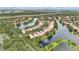 Aerial view of the neighborhood featuring lovely homes along the lake with lots of lush, green trees at 11834 Gennaro Ln, Orlando, FL 32827
