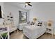 Bedroom with two twin beds, a window with black and white checkered curtains, and hardwood floors at 11834 Gennaro Ln, Orlando, FL 32827
