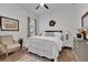 Bright bedroom with wood floors, a ceiling fan, a neutral color scheme, and a reading nook at 11834 Gennaro Ln, Orlando, FL 32827