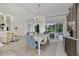 Elegant dining room with chandelier and sliding glass doors to screened in lanai at 11834 Gennaro Ln, Orlando, FL 32827