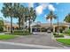Stunning community building with manicured landscaping, palm trees, and convenient drive-up access at 11834 Gennaro Ln, Orlando, FL 32827
