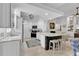 Bright kitchen featuring granite countertops, stainless appliances, and a cozy breakfast bar at 11834 Gennaro Ln, Orlando, FL 32827