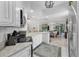 Well-appointed kitchen with white cabinetry, modern appliances, and an open layout at 11834 Gennaro Ln, Orlando, FL 32827