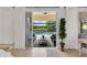 Open floor plan with large sliding glass doors leading to a screened pool area at 11834 Gennaro Ln, Orlando, FL 32827