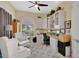Office featuring built in shelves, a ceiling fan, a large window, and neutral colored walls at 11834 Gennaro Ln, Orlando, FL 32827