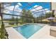 Gorgeous screened-in pool and lanai featuring a beautiful view of the pond at 11834 Gennaro Ln, Orlando, FL 32827
