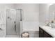 Bathroom showcasing a glass shower, soaking tub, and granite-topped vanity at 12084 Sumter Dr, Orlando, FL 32824