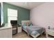 Stylish bedroom with a soft bed, a desk and colorful accents at 12084 Sumter Dr, Orlando, FL 32824