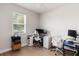 Bright home office with two workstations, a window for natural light, and ceiling fan at 12084 Sumter Dr, Orlando, FL 32824
