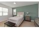 Calming bedroom with a queen-sized bed, accent furniture and neutral decor at 12084 Sumter Dr, Orlando, FL 32824