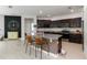 Well-lit kitchen with granite countertops, stainless steel appliances, and a large island with bar seating at 12084 Sumter Dr, Orlando, FL 32824