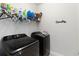 Modern laundry room with front-load washer and dryer at 12084 Sumter Dr, Orlando, FL 32824