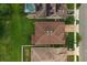Aerial view of a property featuring a well-maintained lawn and roof in a suburban neighborhood at 1270 Fountain Coin Loop, Orlando, FL 32828