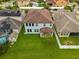 Aerial view of a backyard, showcasing a well-manicured lawn and privacy fence at 1270 Fountain Coin Loop, Orlando, FL 32828