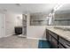 Modern bathroom showcasing double vanities, granite countertops, and a large walk-in shower at 1270 Fountain Coin Loop, Orlando, FL 32828