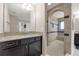 Modern bathroom showcasing a spacious walk-in shower, dark cabinets, and granite countertops at 1270 Fountain Coin Loop, Orlando, FL 32828