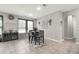 Bright dining area with a dark wood table, four chairs, and decorative wall art at 1270 Fountain Coin Loop, Orlando, FL 32828