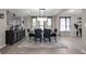 Elegant dining room with a stylish chandelier, a decorative buffet, and seating for six at 1270 Fountain Coin Loop, Orlando, FL 32828