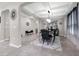 Spacious dining area with a decorative chandelier, an elegant table setting, and tray ceiling at 1270 Fountain Coin Loop, Orlando, FL 32828