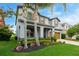 Well-maintained home featuring a tidy lawn, manicured shrubbery, and appealing exterior paint at 1270 Fountain Coin Loop, Orlando, FL 32828