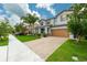 Inviting home exterior boasting well-kept landscaping, mature trees, and a clean, colorful facade at 1270 Fountain Coin Loop, Orlando, FL 32828