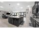 Spacious kitchen with a granite island, open to the living room and featuring stainless appliances at 1270 Fountain Coin Loop, Orlando, FL 32828
