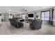 Open living room with tile flooring, decorative shelves, a ceiling fan, and seamless access to other areas at 1270 Fountain Coin Loop, Orlando, FL 32828