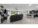Expansive living space with open layout seamlessly integrates the kitchen, dining, and Gathering areas at 1270 Fountain Coin Loop, Orlando, FL 32828