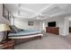 Spacious main bedroom featuring a tray ceiling, a chandelier and a large television at 1270 Fountain Coin Loop, Orlando, FL 32828