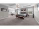 Large primary bedroom with tray ceilings, plush carpet, and bright natural light at 1270 Fountain Coin Loop, Orlando, FL 32828