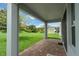 Covered patio overlooking a well-manicured lawn and landscaped backyard at 1270 Fountain Coin Loop, Orlando, FL 32828