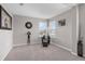 Cozy sitting area with carpet, a vase, a clock and a chair with a footstool at 1270 Fountain Coin Loop, Orlando, FL 32828
