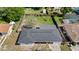 Aerial view of the home, showing the roof, fenced backyard, and surrounding greenery at 1432 Findlay St, Deltona, FL 32725